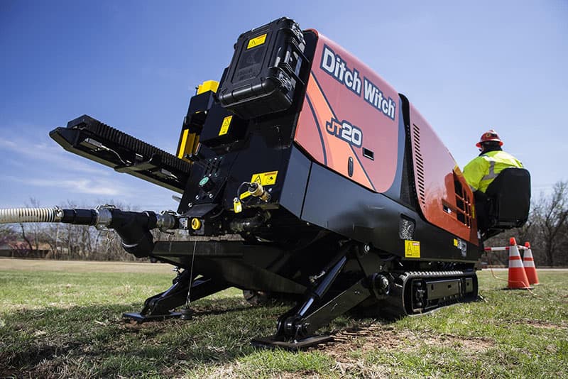 Ditch Witch JT20 horizontal directional drill set up on a grass right-of-way